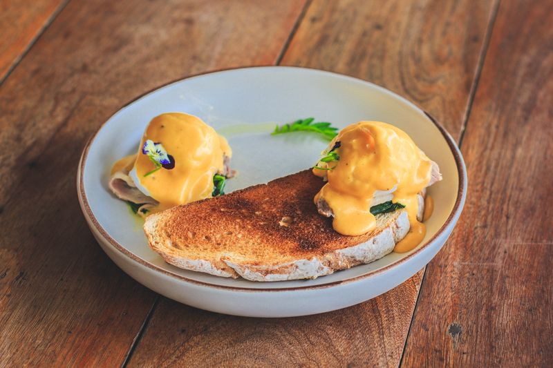 Tatte avocado toast with poached eggs on sourdough